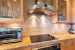 Enjoy beautiful granite counter tops and custom tile work throughout the kitchen